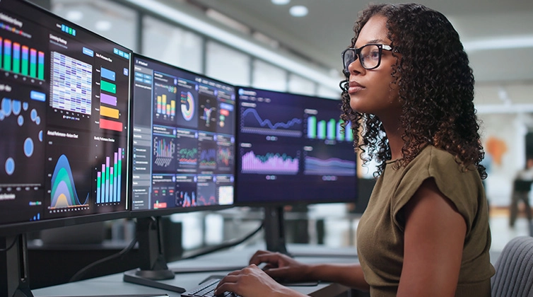 Woman looking at computer monitor