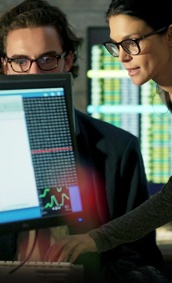 Man and woman looking at laptop