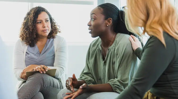 Three women talking