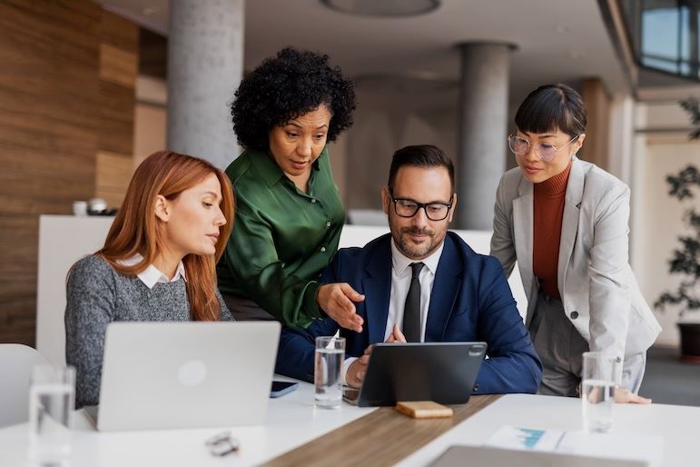 IT Managers looking at laptop