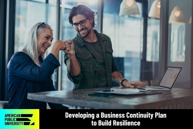 business-continuity business partners bumping fists