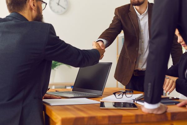 entreprenurship and business degree students shaking hands