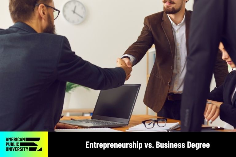 entrepreneurship-vs-business-degree entreprenurship and business degree students shaking hands