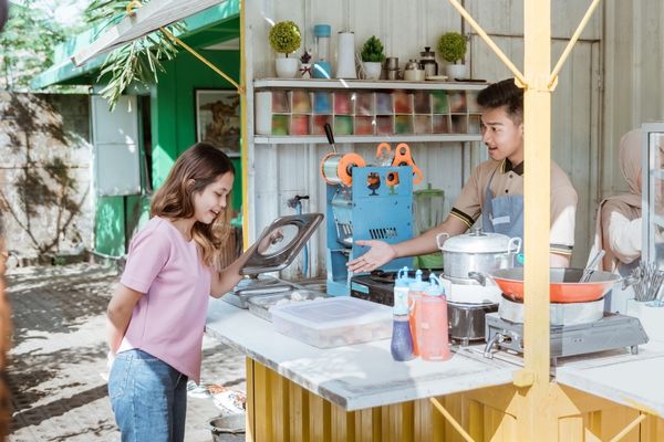 entrepreneur operating soap stand