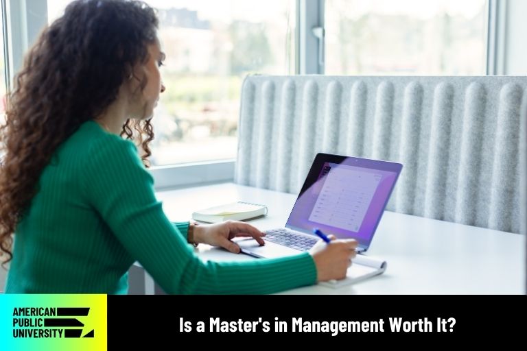 masters in management student on laptop