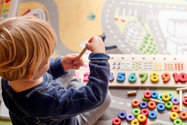 preschool student playing with puzzle