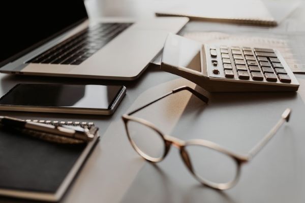 accountant calculator and laptop