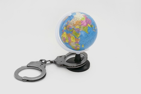 handcuffs around globe