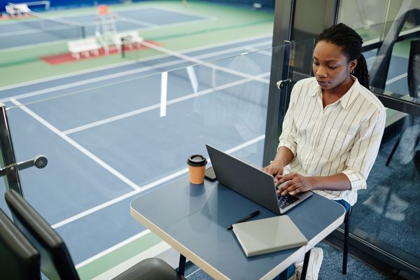 sports administrator on laptop