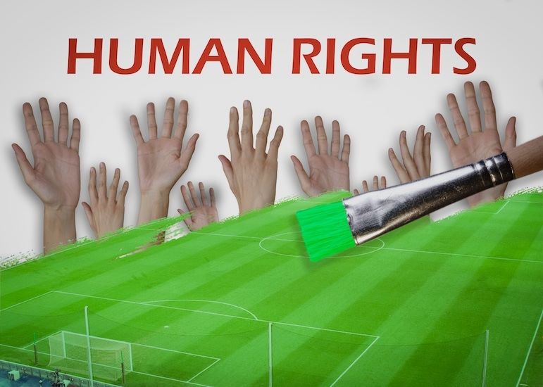 sportsmanship depicted by teammates hands raised on soccer field
