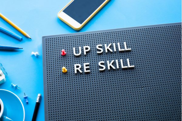 up skill and re skill written on peg board