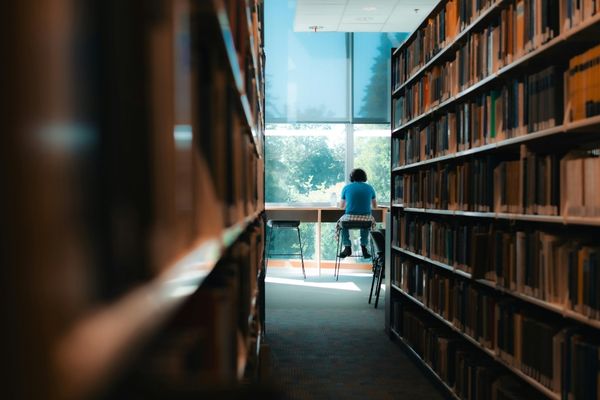 military history masters student studying in library