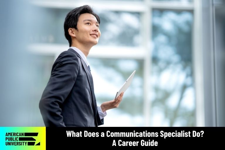 communication specialist holding tablet and smiling