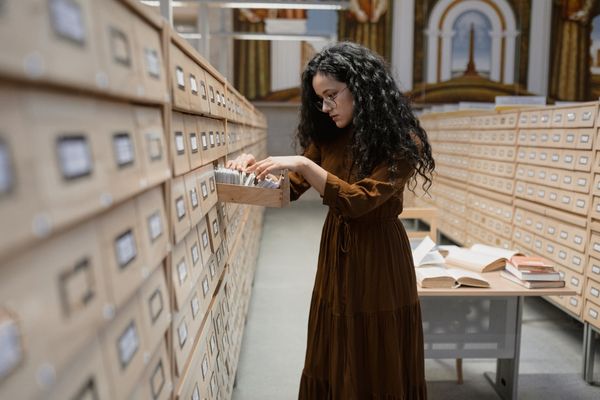 military historian looking in library card catalog