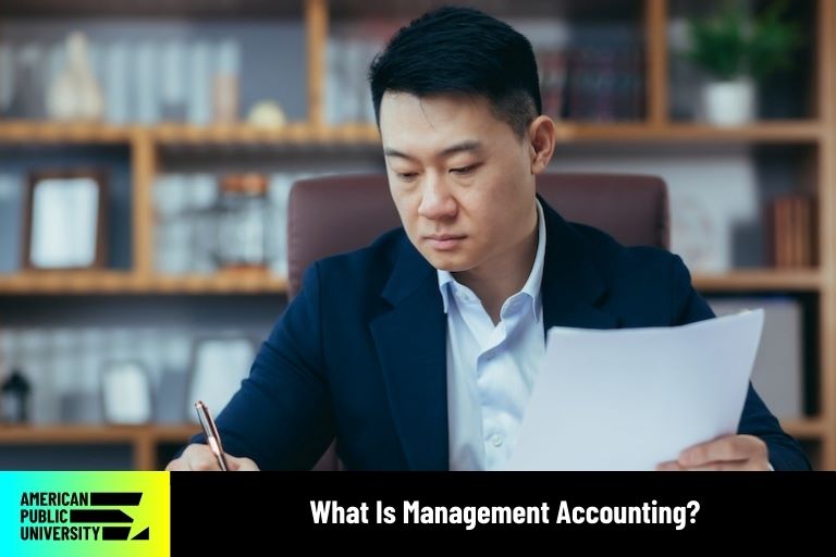 management accounting professional writing on documents