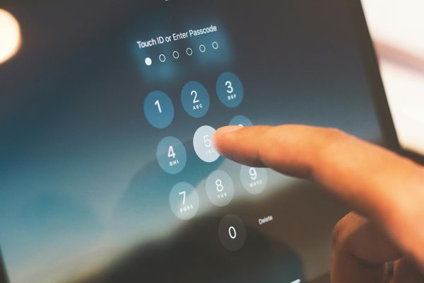 mobile security professional entering passcode on tablet