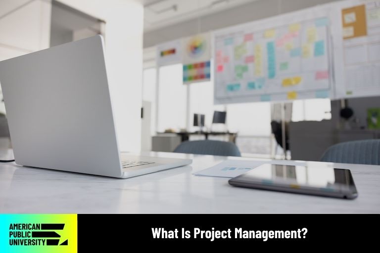 project manager office with laptop and whiteboard